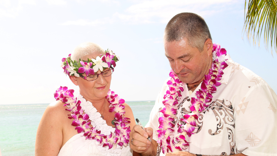 Kerry and her husband, Bill, getting married on the beach in Hawaii